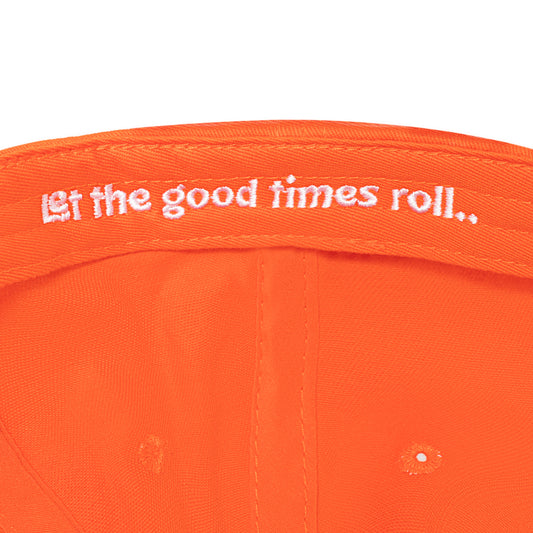 Interior of King's Hawaiian orange hat that reads, "let the good times roll.."
